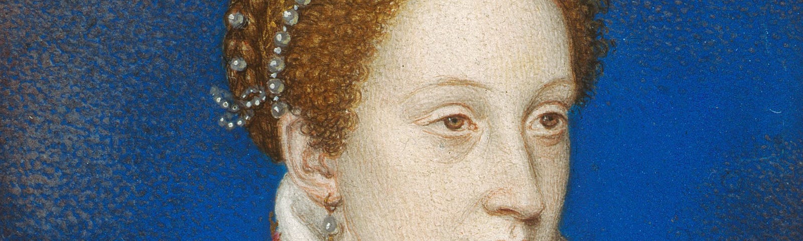 Painting of 17-year-old Mary Queen of Scots. She is wearing a red dress. Her red hair is up and adorned with jewels.