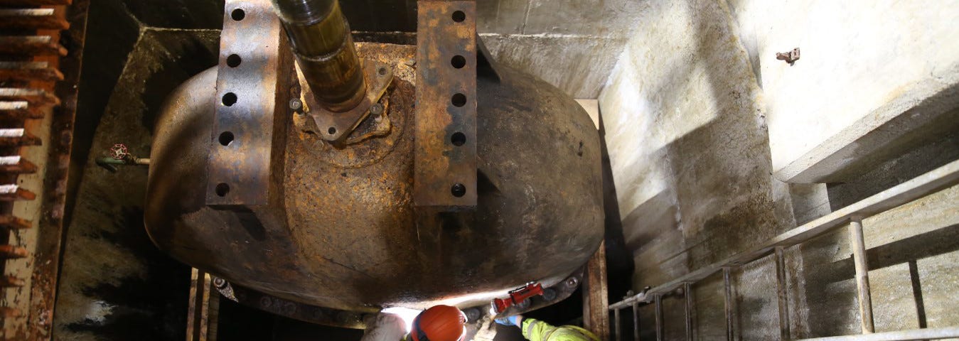 Workers repair a century old valve at Ashokan Reservoir.
