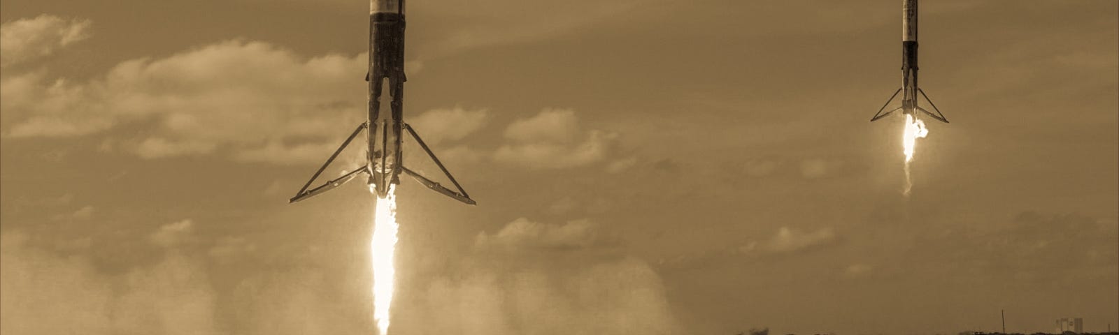 SpaceX Falcon Heavy Landing, with cupcakes in hand for Fiction hiding behind the garden shrubbery