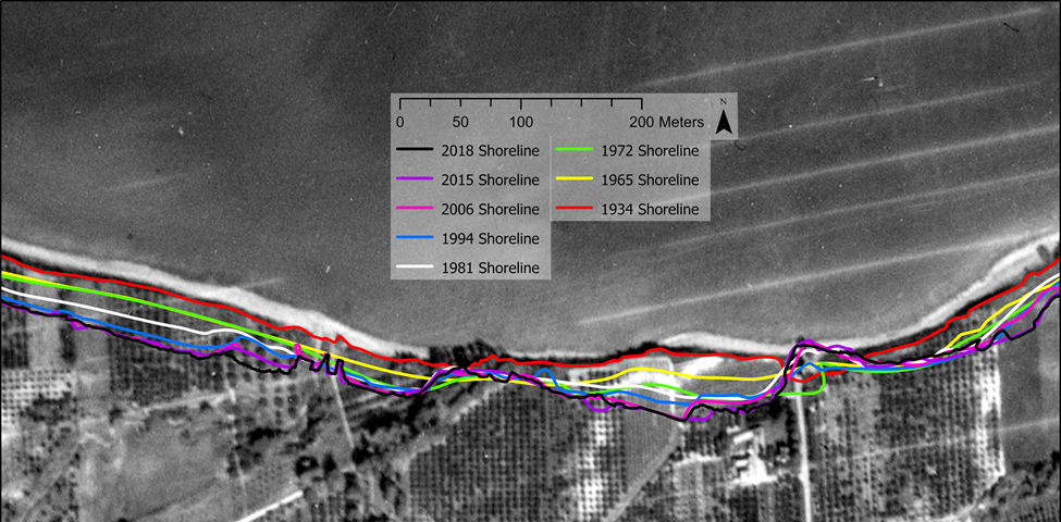 A black and white aerial photo of a shoreline with different coloured lines indicating the changes to the shoreline over the years.