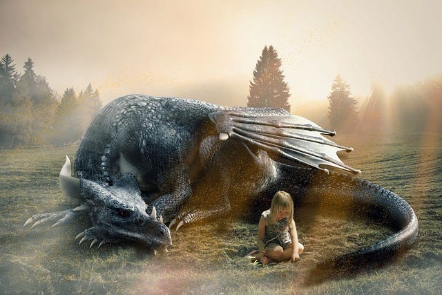 A large dragon quietly sleeping behind a little girl seated on the ground