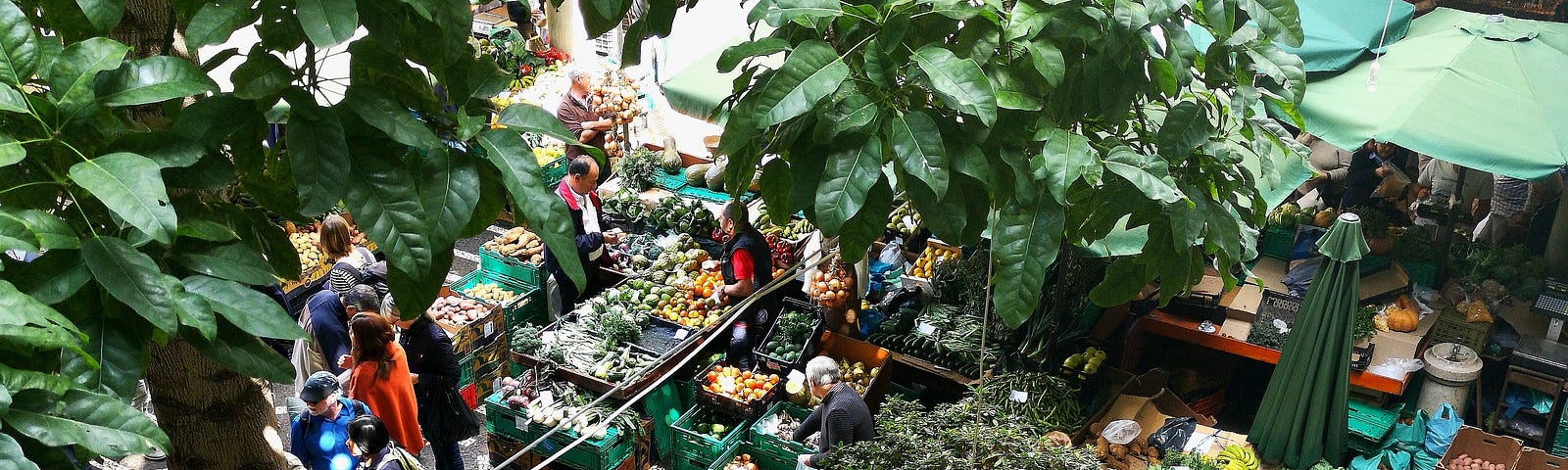 Aerial view of an outdoor street market selling fresh fruit and vegatables