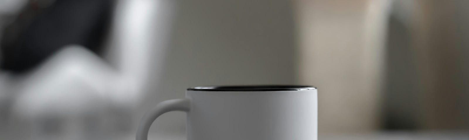 a white mug with the word “conversations” written on it