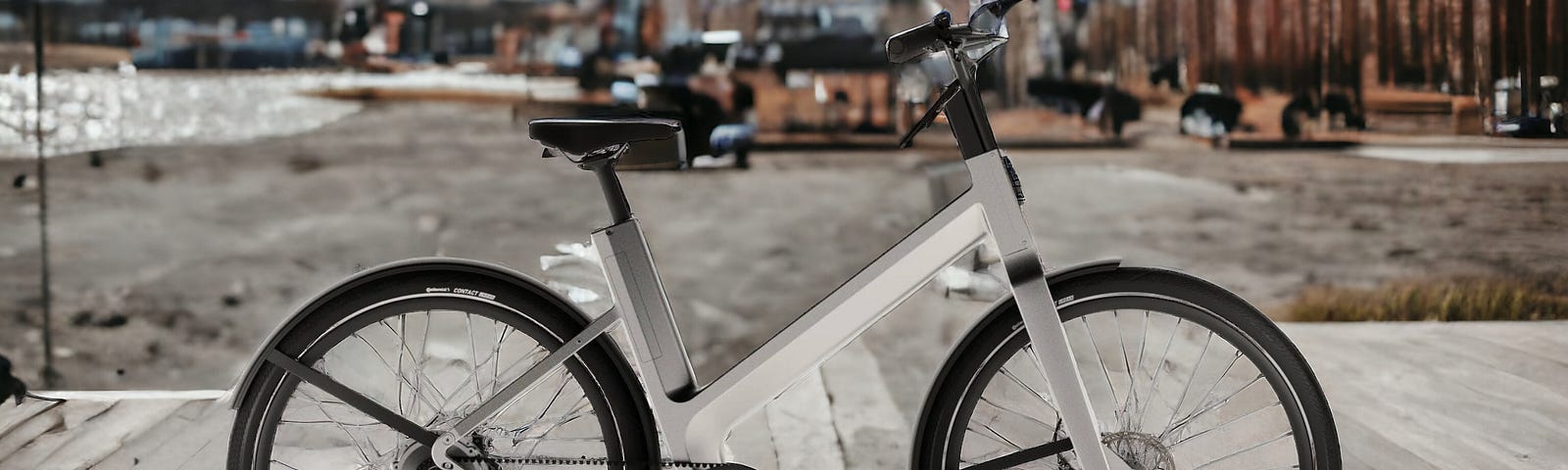 A view of the Anod Tribrid Electric Bike on display in an urban setting.