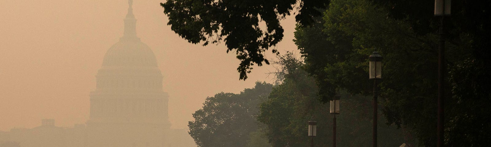 A person runs on the National Mall as the U.S. Capitol is shrouded in haze and smoke caused by wildfires in Canada, in Washington, D.C., June 8, 2023. Photo by Amanda Andrade-Rhoades/Reuters