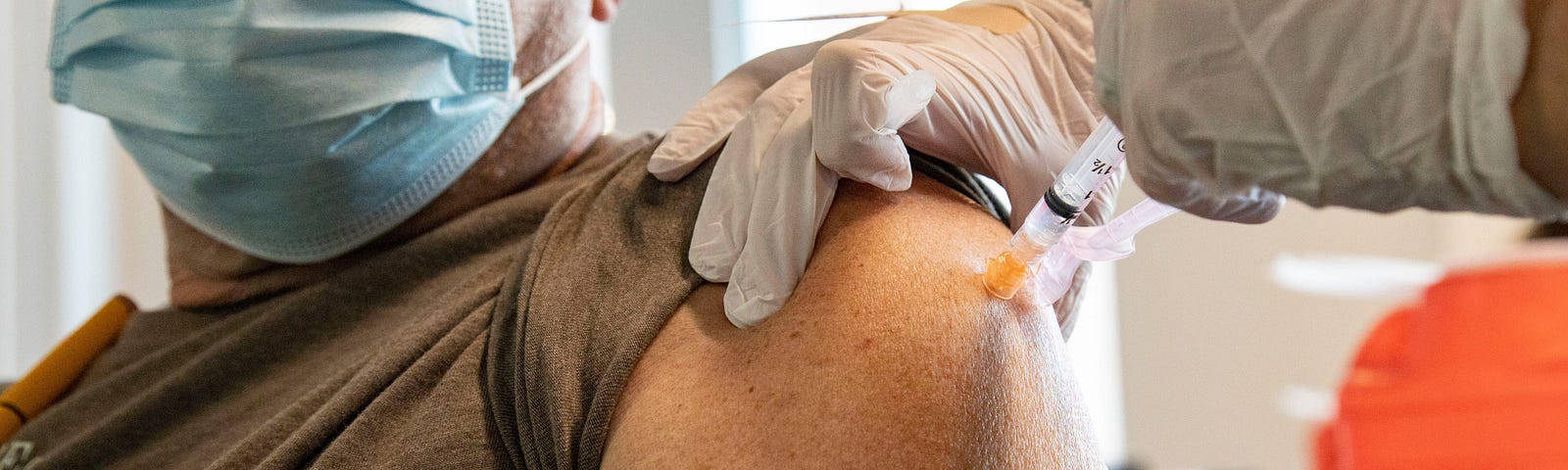 A person receives the COVID-19 vaccine.