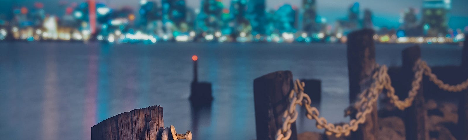 Chained wooden posts along a serene waterside, symbolizing method chaining in Python programming for robust and elegant code structures.