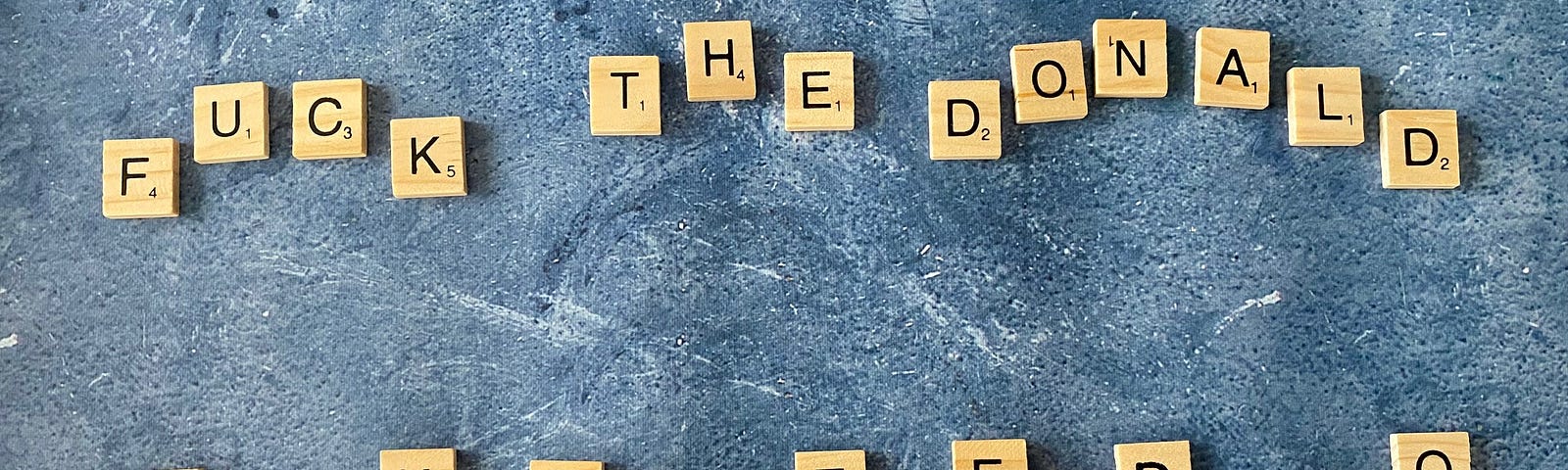 Anagram “Fuck the Donald” and “Dank Cult Fed Ho” using Scrabble tiles