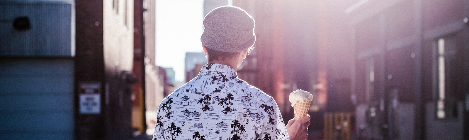 A person holding an ice cream cone.