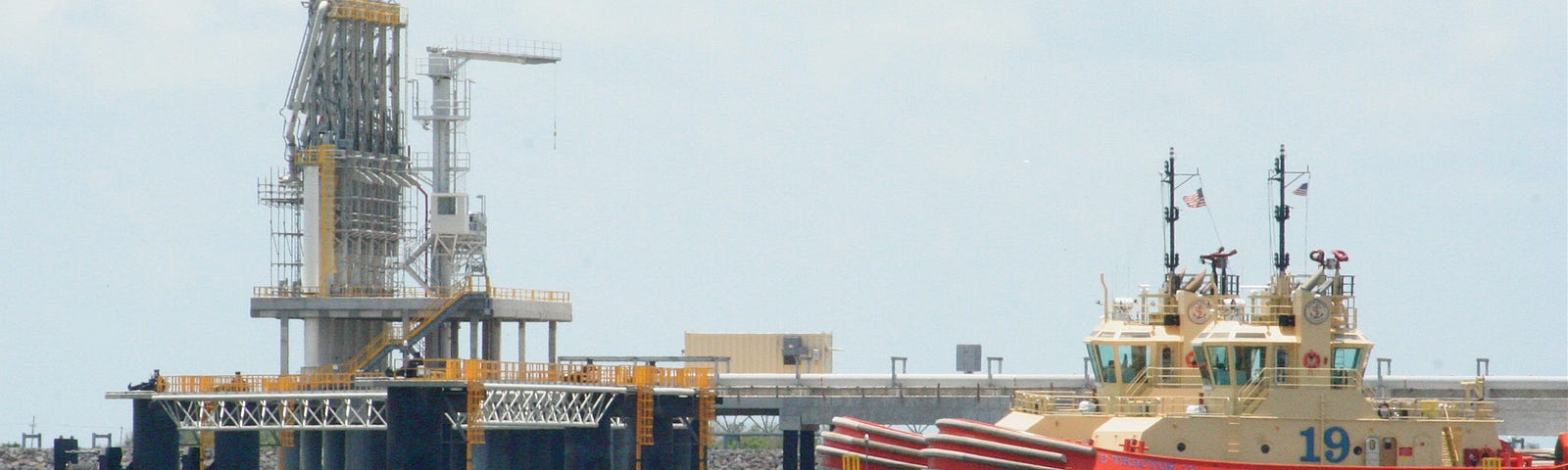 Tugboats and tankers at the Sabine Pass LNG terminal