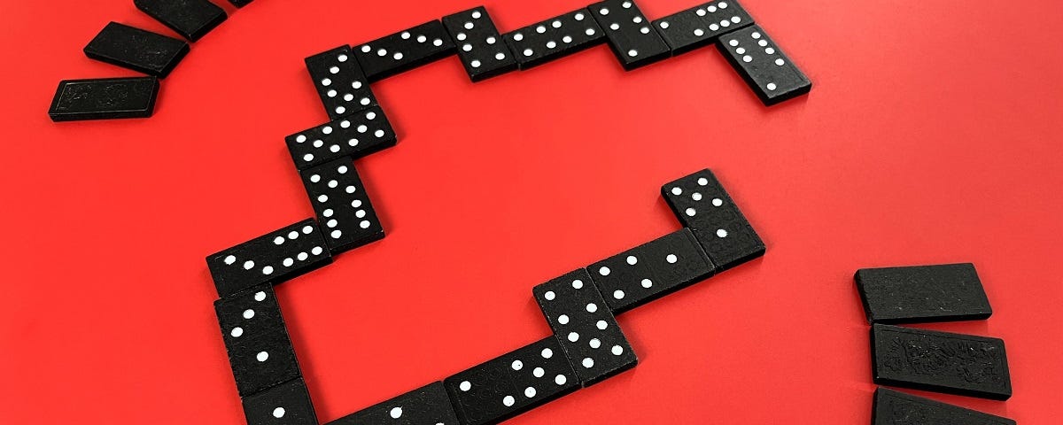 A simulated game of dominoes in play.