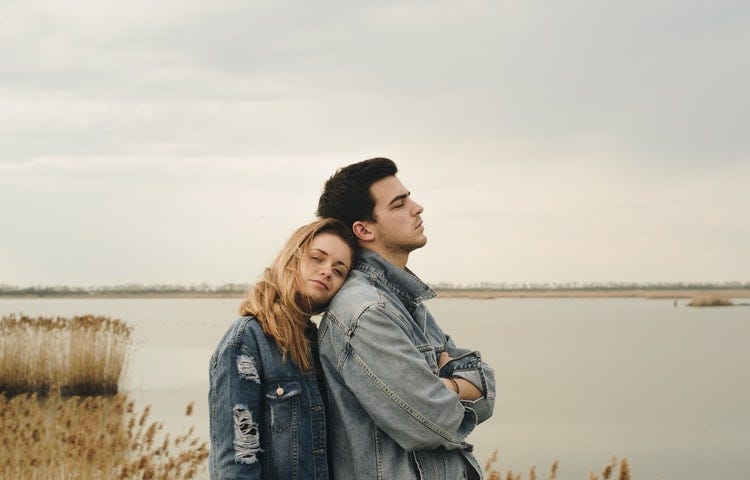 couple standing by a lake in Serbia