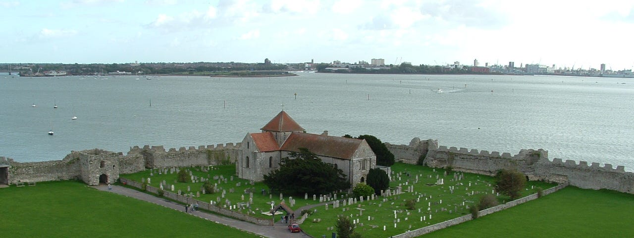 view from the keep of Portchester Castle showing St Mary’s church