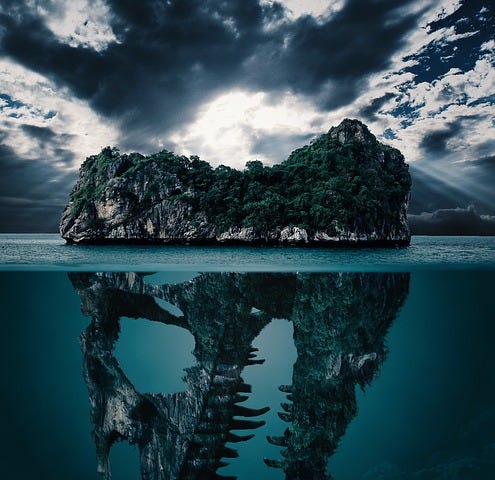 An island in the ocean that transforms into a dinosaur skull beneath the water line