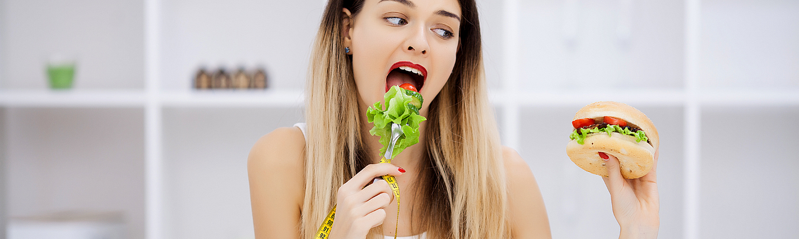 A woman trying to eat healthy and wanting something else in Do You Struggle To Stick To A Diet? Here’s How To Finally Break Free