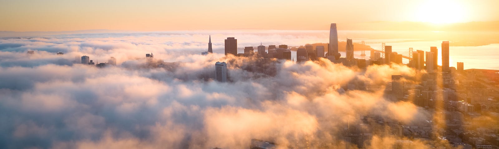 Clouds below city skyscrapers
