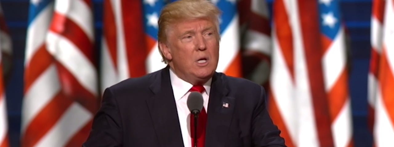 Donald Trump speaks into a microphone