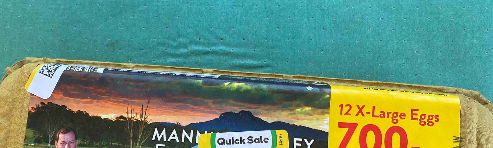 Egg carton with a “Quick sale” sticker on the front.