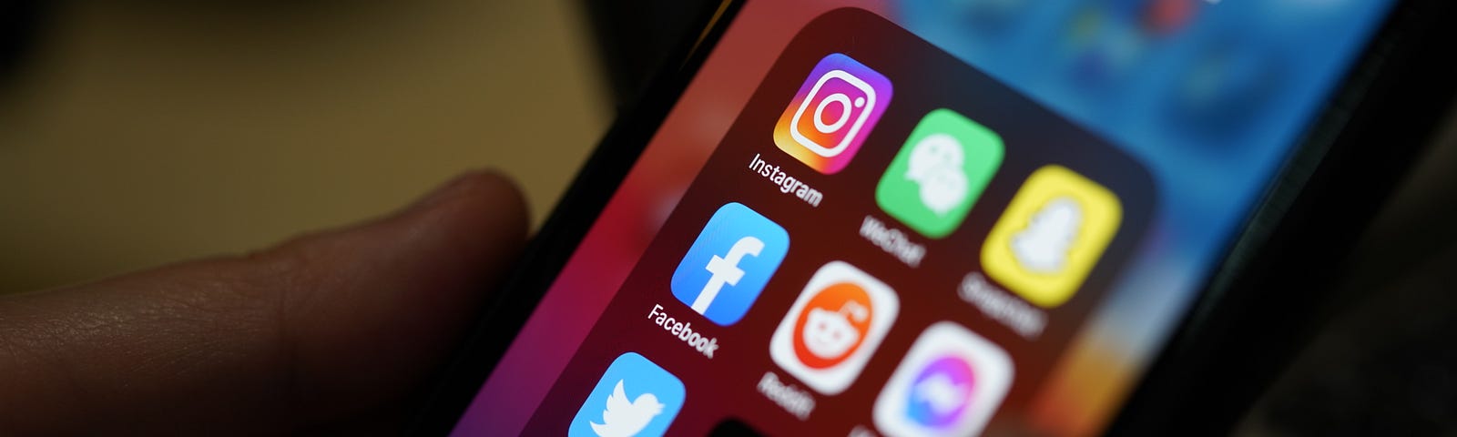 Closeup of phone screen showing social media app icons. Photo by P. Kijsanayothin/Getty Images