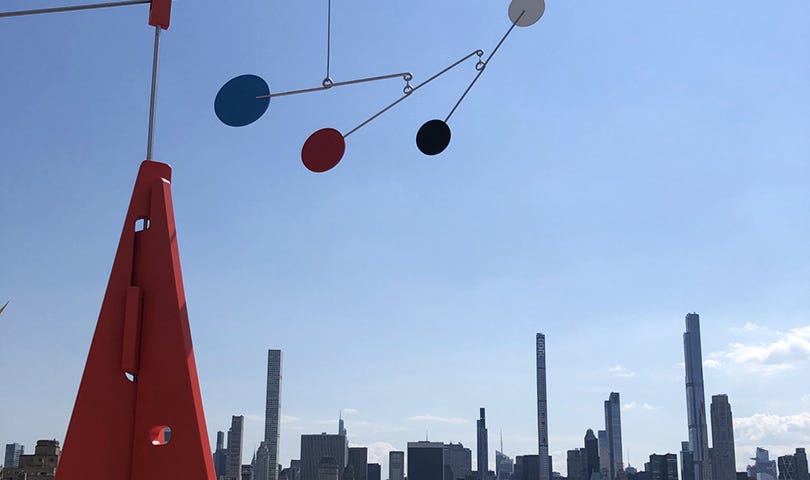 Partial view of roof top sculpture by Alex Da Corte, As Long as the Sun Lasts, on the roof terrace of the Metropolitan Museum in New York. Skyline of New York looking south towards 59th Street. Photo taken in early May, 2021.