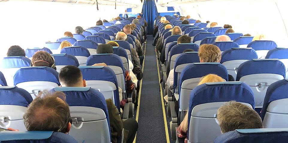 packed BA flight Amsterdam to Heathrow / Daily Mail