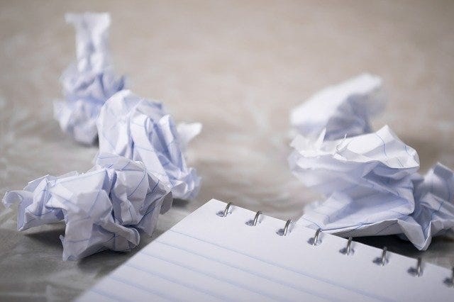 Crumpled up papers resulting from writer’s block