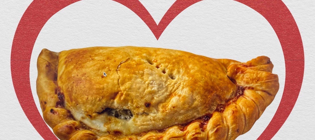 A perfectly prepared pasty ecoompassed by a loving heart picture.