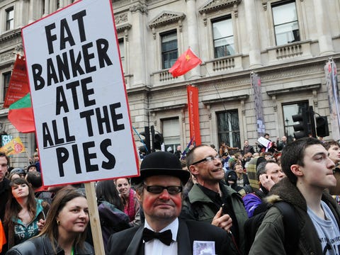 LONDON — MARCH 26: A protester dressed as a banker attends a large anti-cuts rally organised by the TUC March 26, 2011 in London, UK.