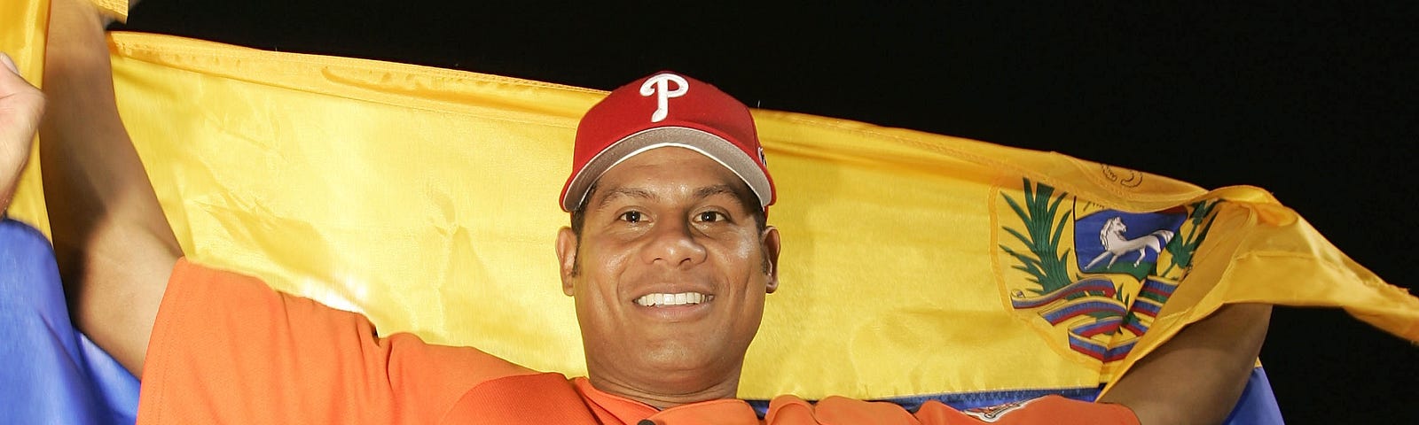 Ryan Howard of the Philadelphia Phillies smiles whie holding a