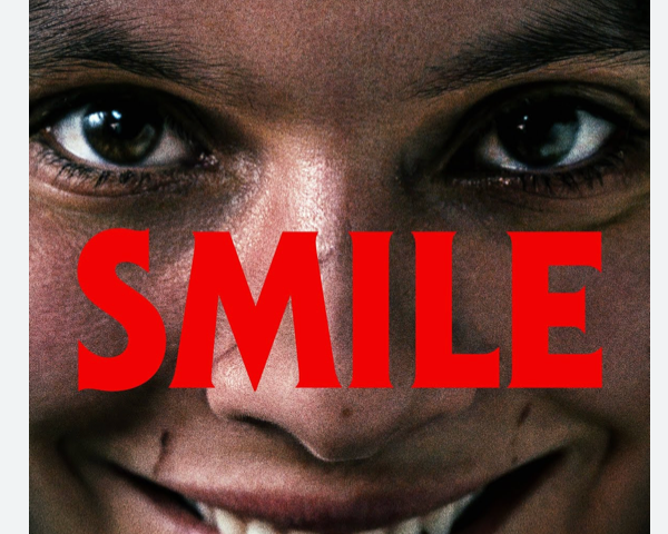 A woman with a very creepy smile and the word “smile”