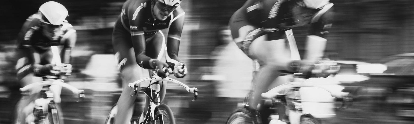 Three racing cyclists