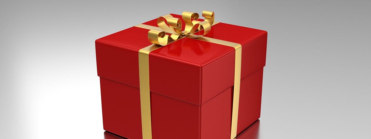 A gift wrapped in wrapping paper to signify buying gifts on Cyber Monday.