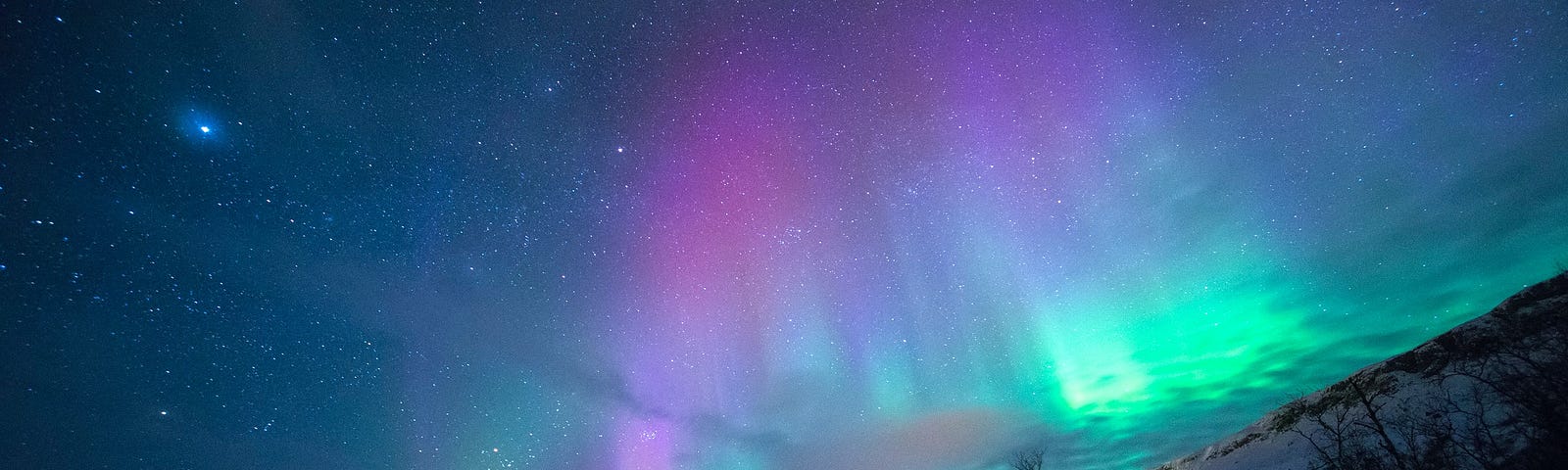 The Aurora Borealis. Tromse, Norway. Image from Lightscape via Unsplash