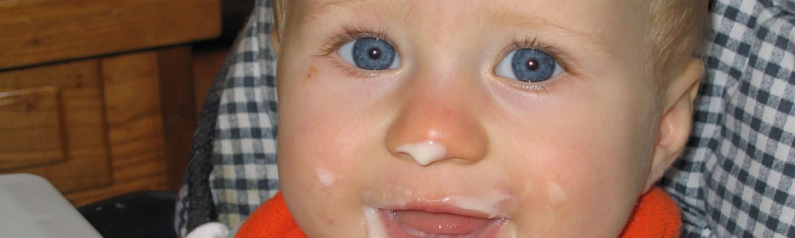baby with food on her face — medium story boost