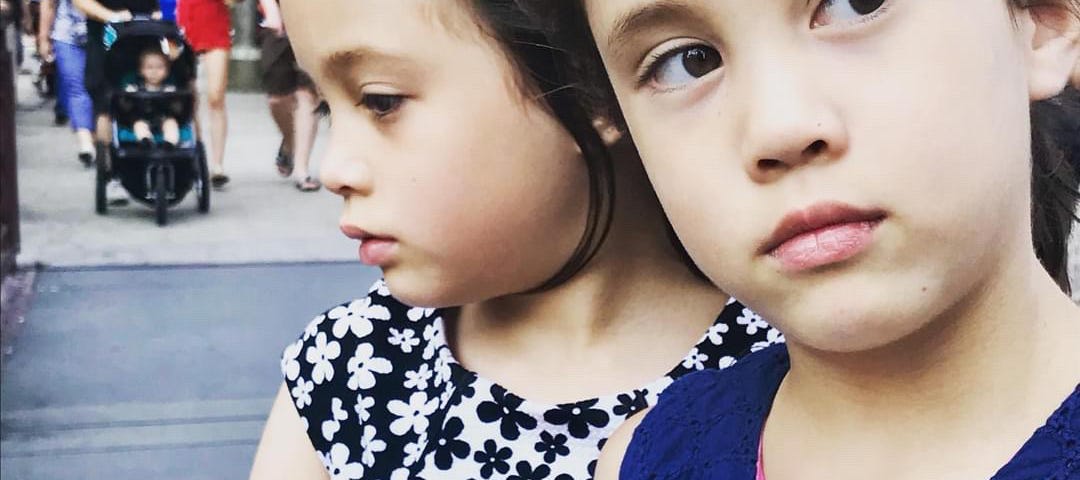photo of two young girls thoughtful in mind