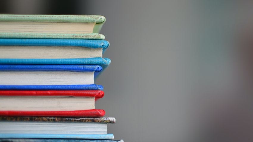 stack of books, covers in different colors