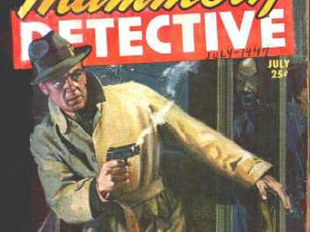 There’s a copy of a pulp magazine cover. The magazine is called Mammoth Detective and the cover is a tough-looking private eye in a trench-coat with a smoking Colt .45 pistol in one hand as he cautiously opens a door with the other.