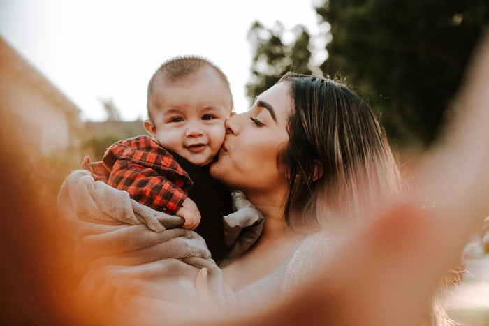 Photo of mother loving her child.