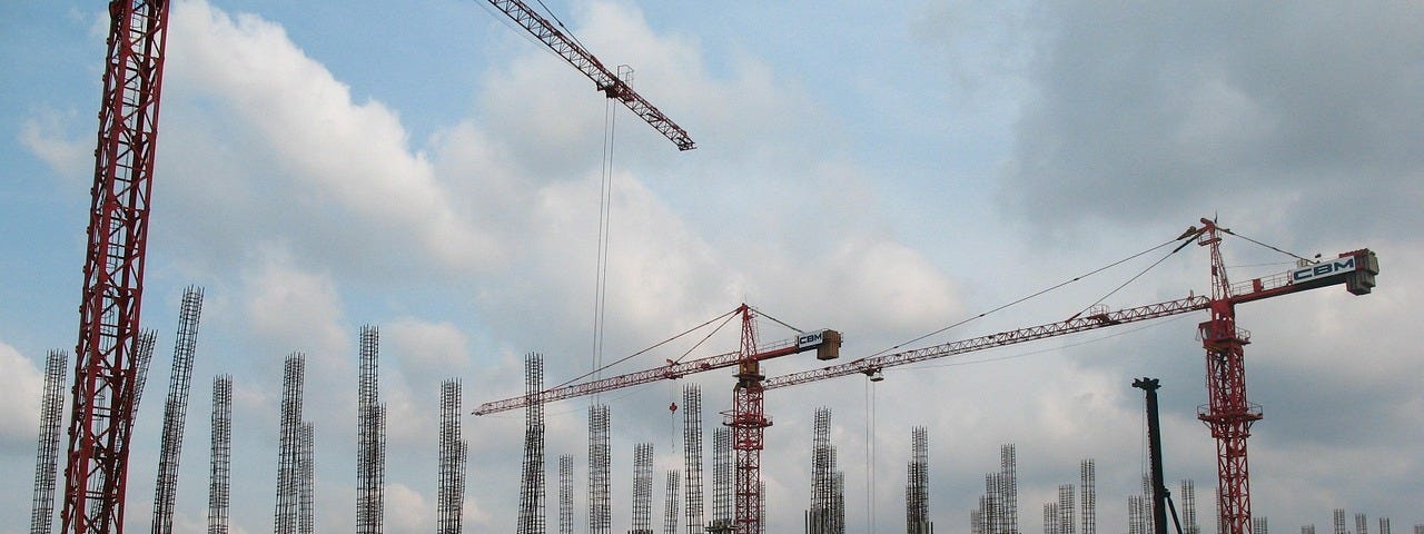 Construction site, many cranes building a building