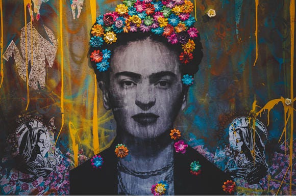 Creative graffiti wall with portrait of Frida Kahlo