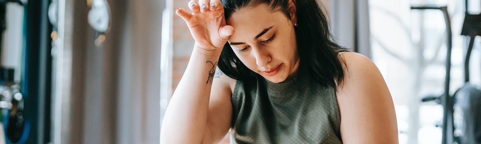 Overweight woman sitting and sighing