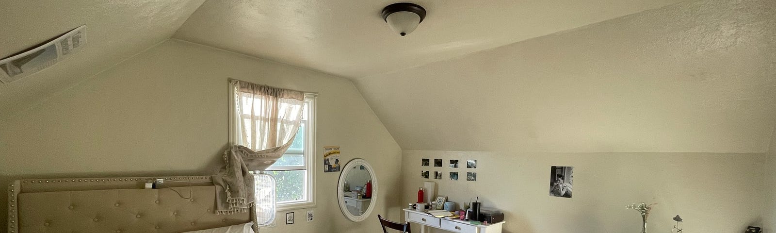 The author’s bedroom with several personal items, namely a guitar in the corner.