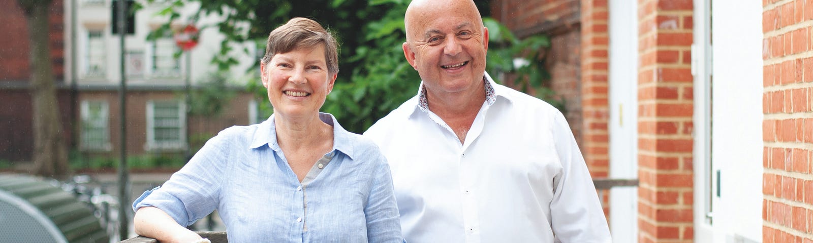 Joanna Elson and Stuart Rogers standing outside the Independent Age offices