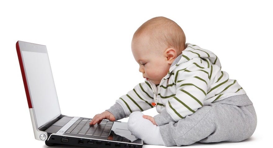 Photo of baby at a computer