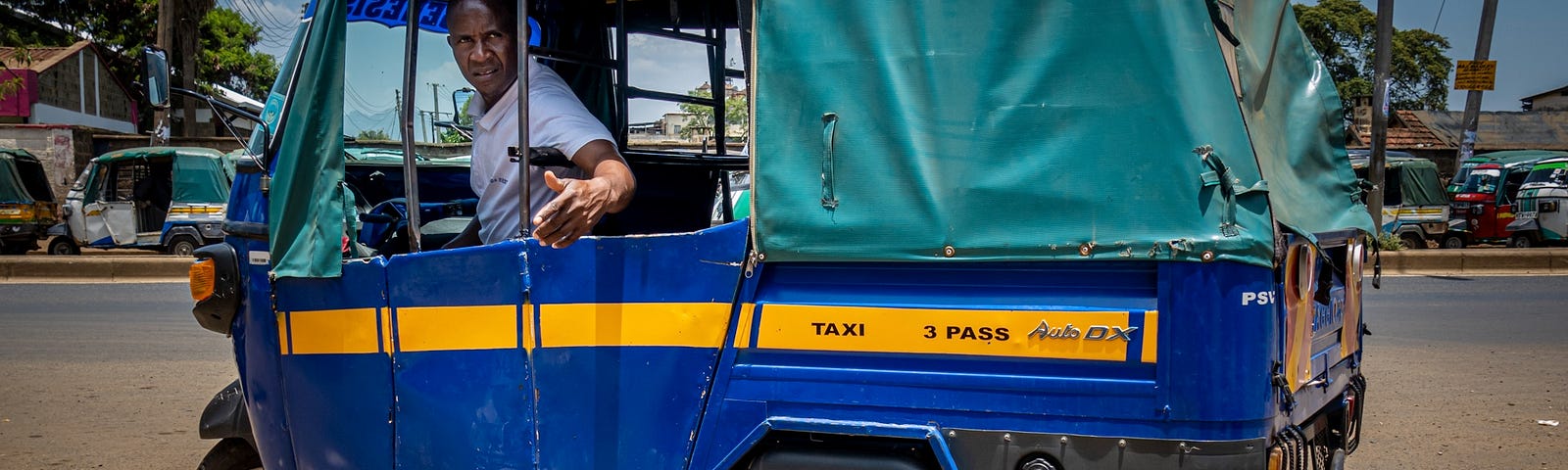 A blue tuk-tuk.