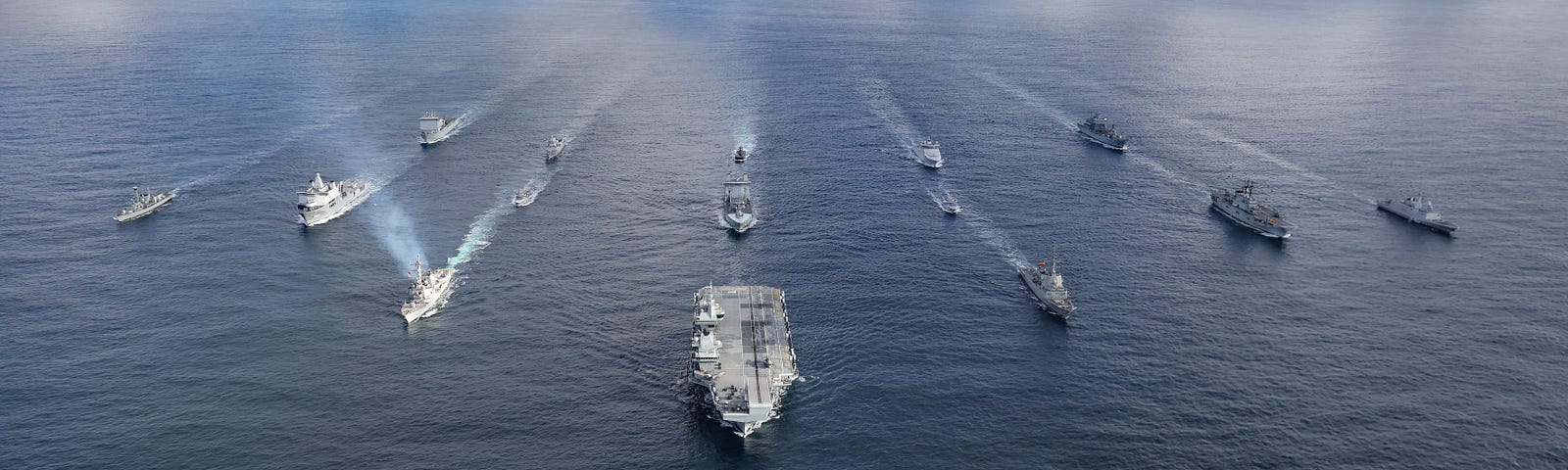 The Royal Navy aircraft carrier HMS Prince of Wales leads a fifteen-ship formation of ships from the United Kingdom Carrier Strike Group and the NATO Amphibious Task Group during Exercise Nordic Response 24 in the Norwegian Sea, March 11, 2024. Photo by Belinda Alker/Royal Navy