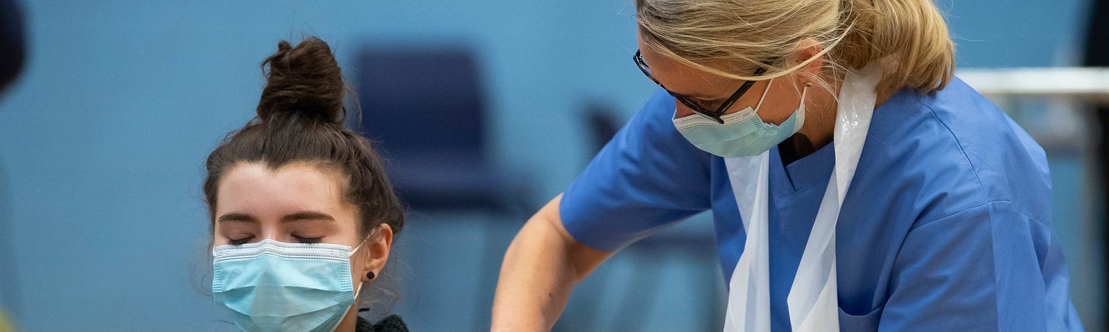 A woman recieving a COVID vaccine in the UK.