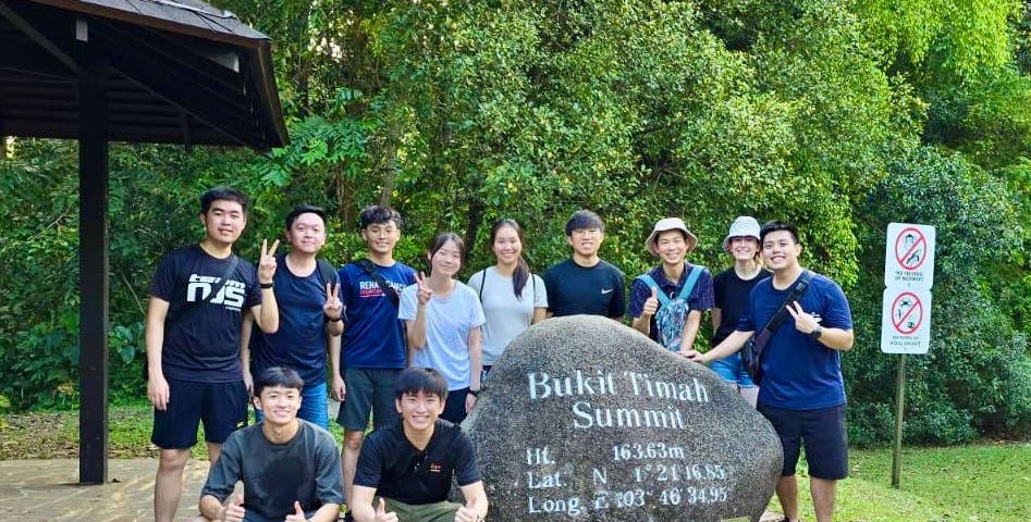 Group picture of the SmartGym team and myself at the Bukit Timah Summit after a hike