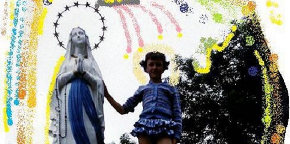 young girl holds hand of Mother Mary statue.