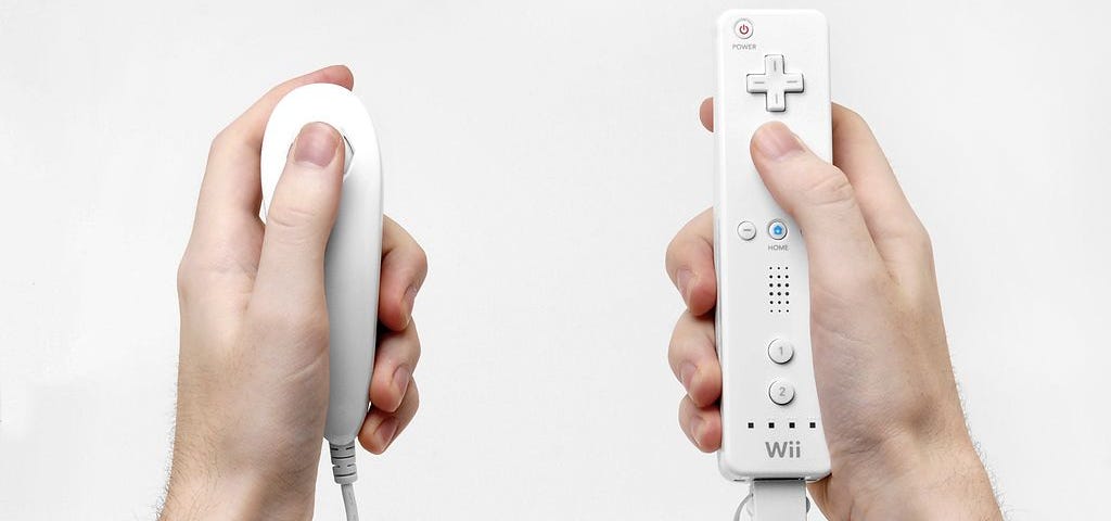 Picture of two hands holding a Wii remote and a Wii nunchuk